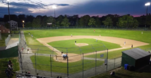 baseball field lit with lights